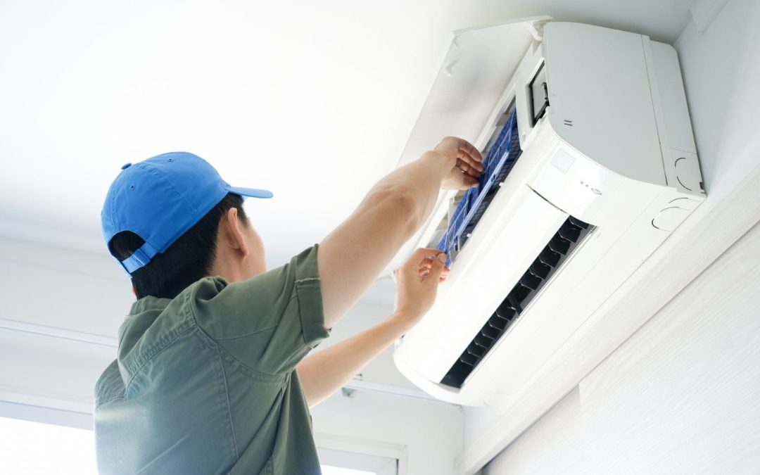 HVAC technician servicing a ductless mini split in Daly City