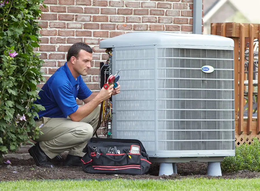 HVAC technician inspecting an outdoor AC unit in Daly City